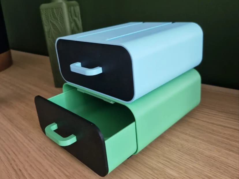 3D-printed stackable storage drawers in mint green and blue
