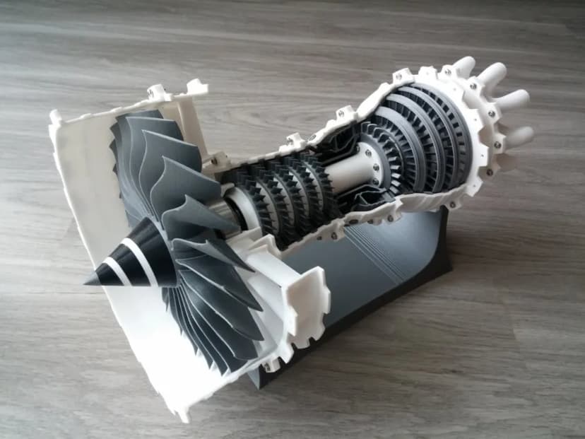 3D-printed jet turbine engine cutaway model showing internal compressor stages