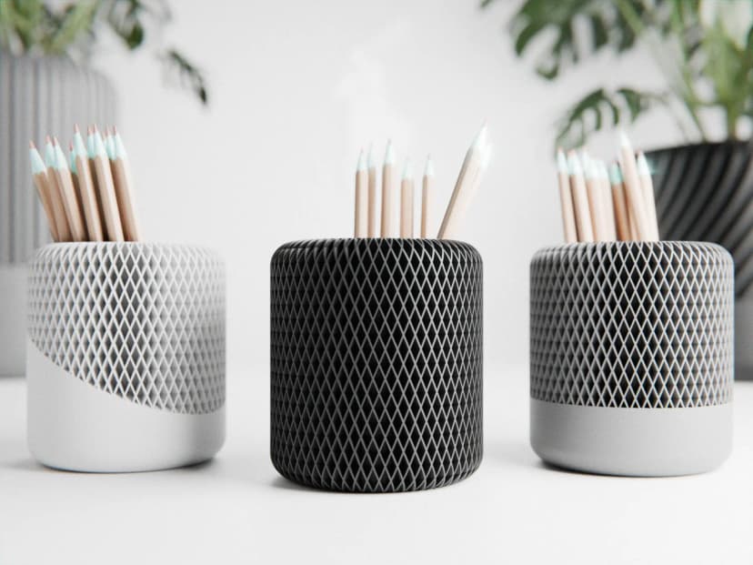 3D-printed pencil holders with diamond lattice pattern in black and gray